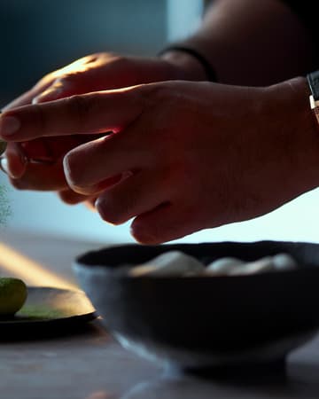 Hands of Chef Himanshu Saini, Jaeger-LeCoultre ambassador, with REVERSO TRIBUTE CHRONOGRAPH watch Q389257J