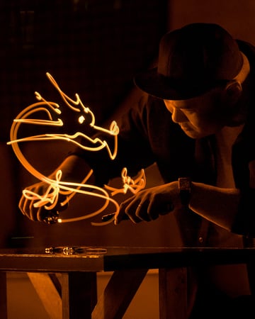 Jaeger-LeCoultre - Street light painter Roy Wang working a creation on a Reverso Monoface