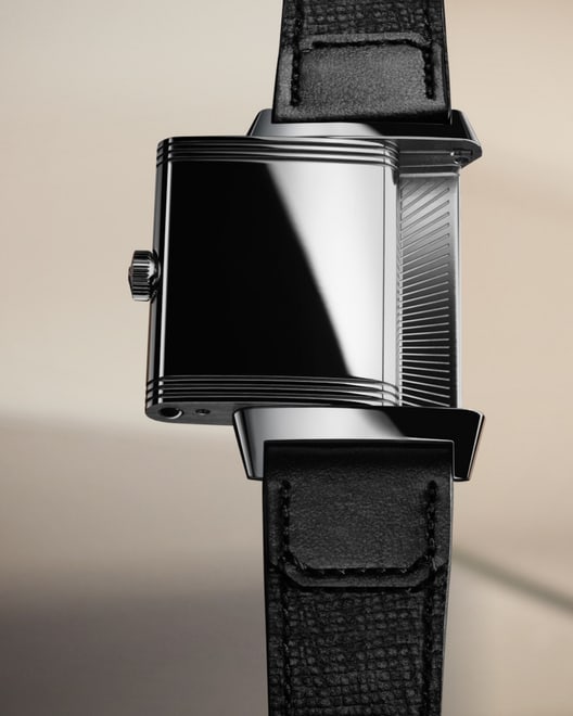 Levitation asset of the Jaeger-LeCoultre Reverso Tribute Monoface watch on its stainless steel side with a black fagliano strap